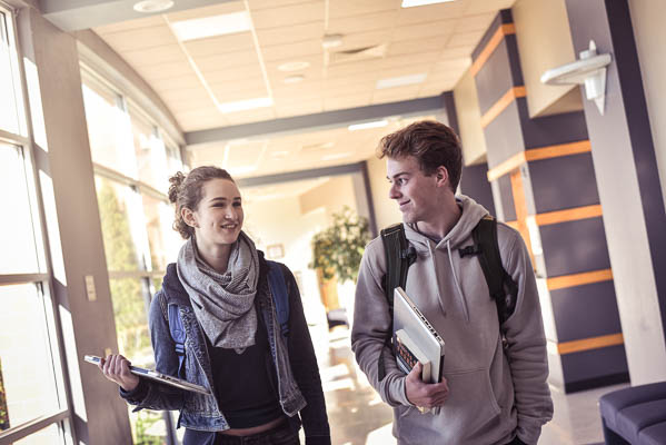 Students walking down a hallway on the UW-Green Bay Manitowoc Campus.