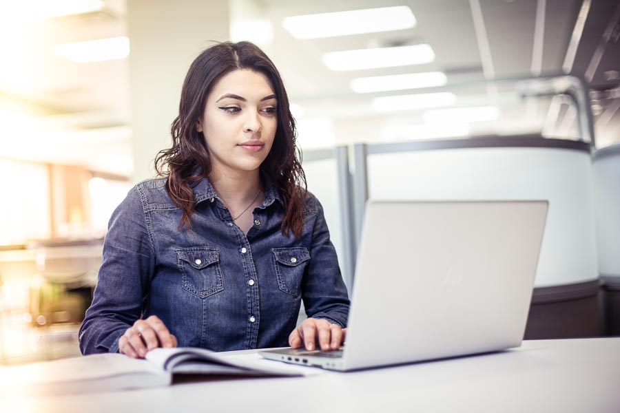 UWGB Student Yasmine Plascencia using a laptop