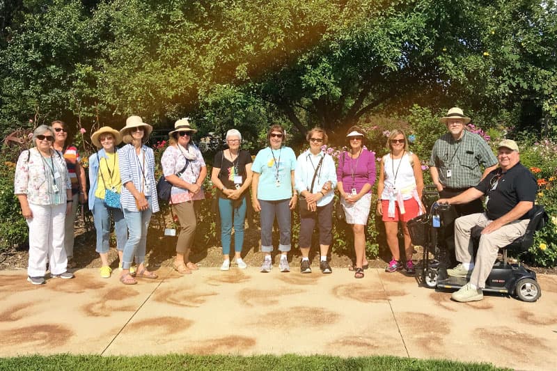 Group of LLI members posing for a group photo outside