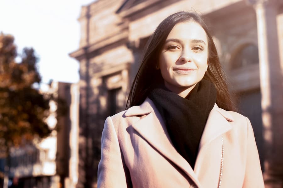 Student poses for photo abroad