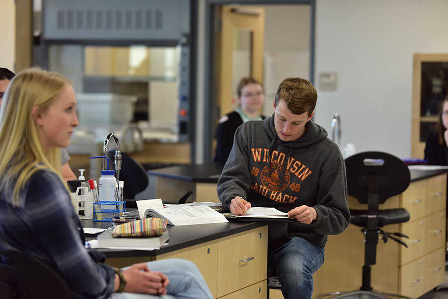 Students taking notes in a Manitowoc campus biology class