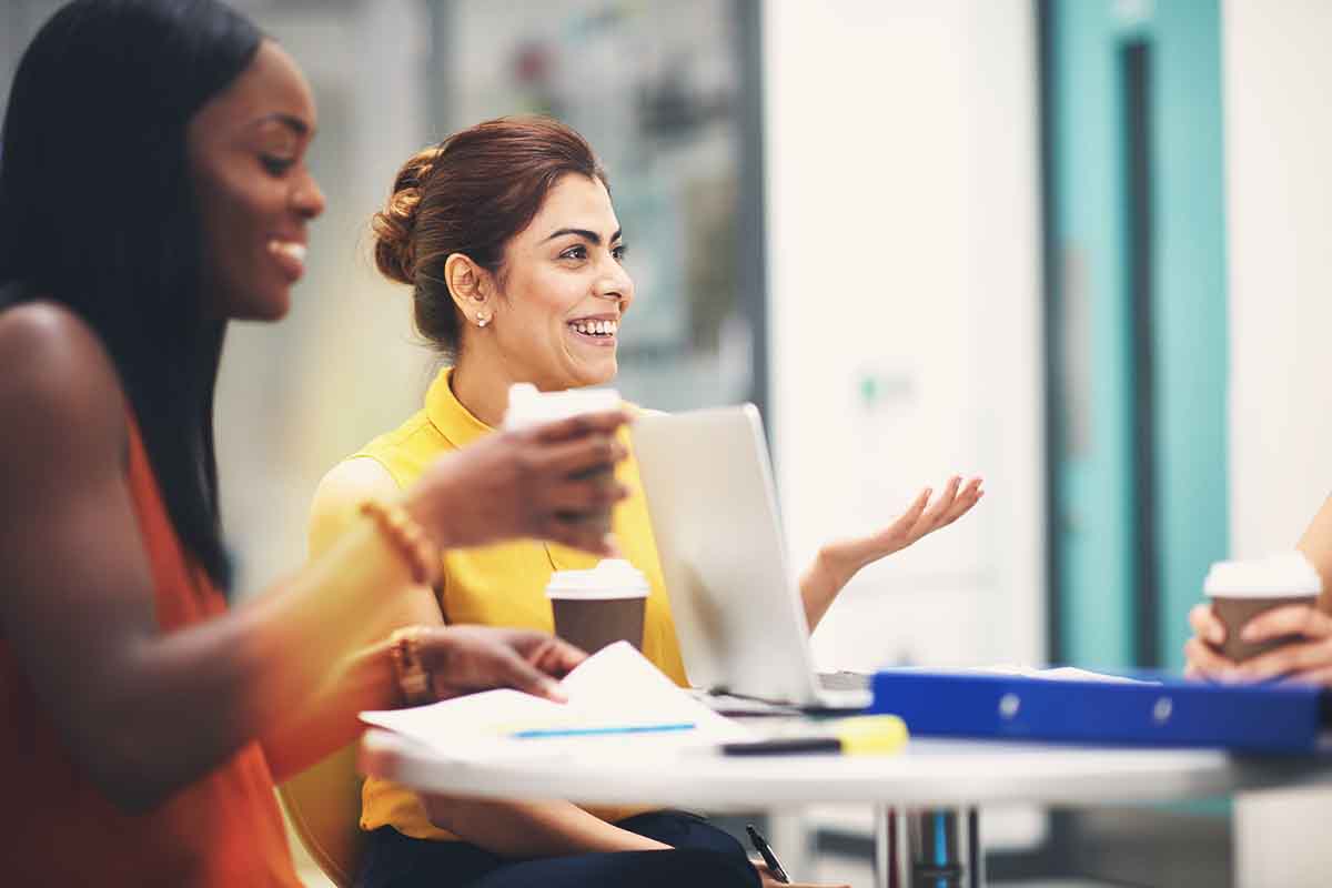 woman wearing yellow leading a discussion