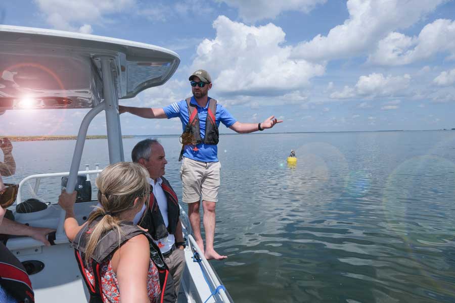 Profesor Christopher Houghton leads educational excursion into the Bay of Green Bay.