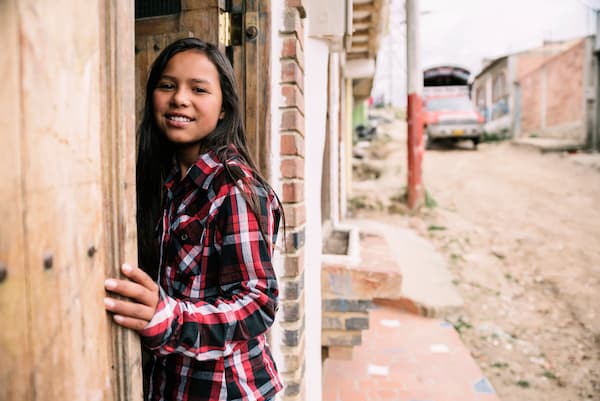 Child in poverty stricken neighborhood