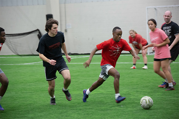 Intramural soccer in the indoor turf gym