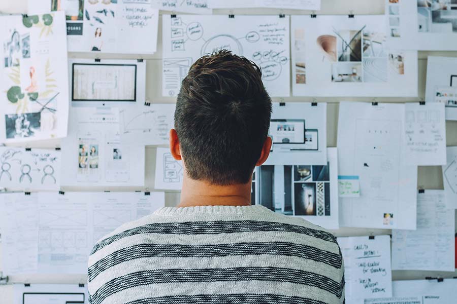 Young man in front of a planning board
