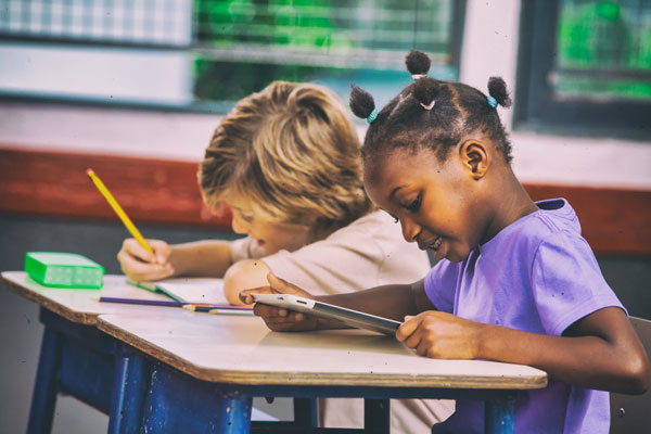 Two elementary students in class
