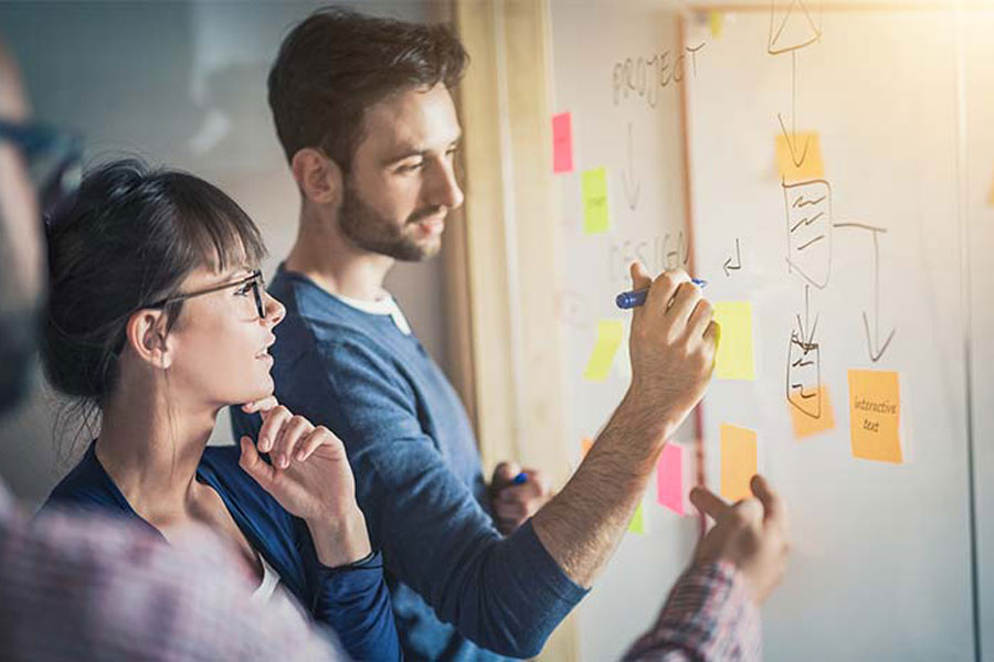 Coworkers work together on business chart
