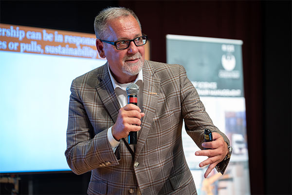 Guy speaking into a microphone