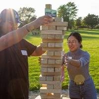 Two business students playing jenga