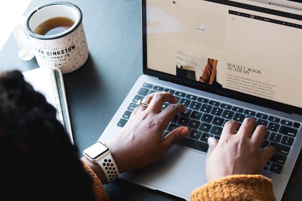 Female typing on laptop