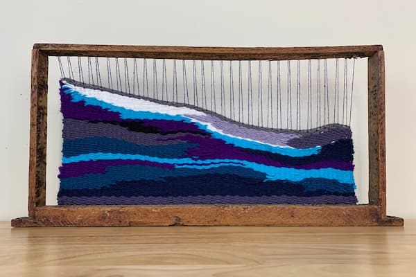 Student's fiber art displayed in gallery