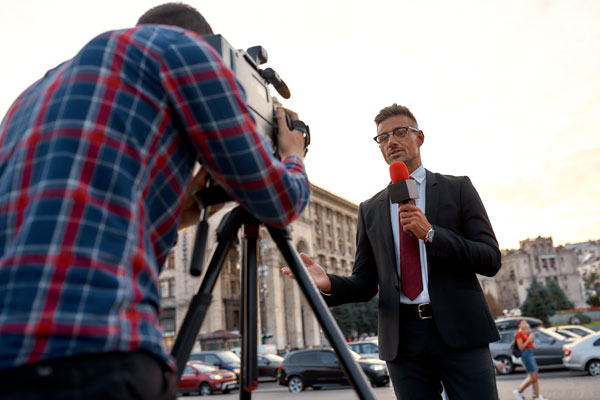 Foreign Correspondent giving news broadcast
