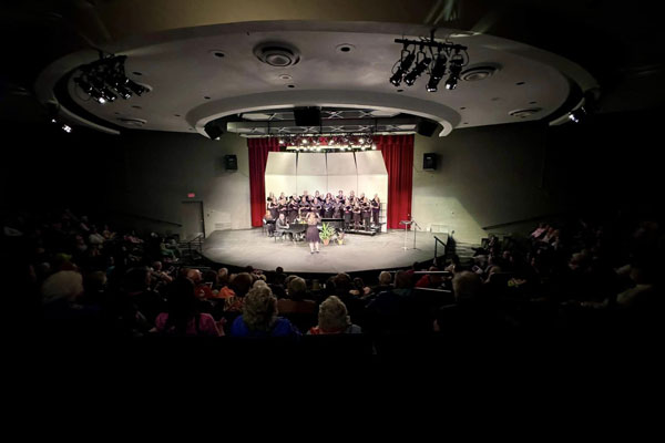 View of a stage with a group of people on it
