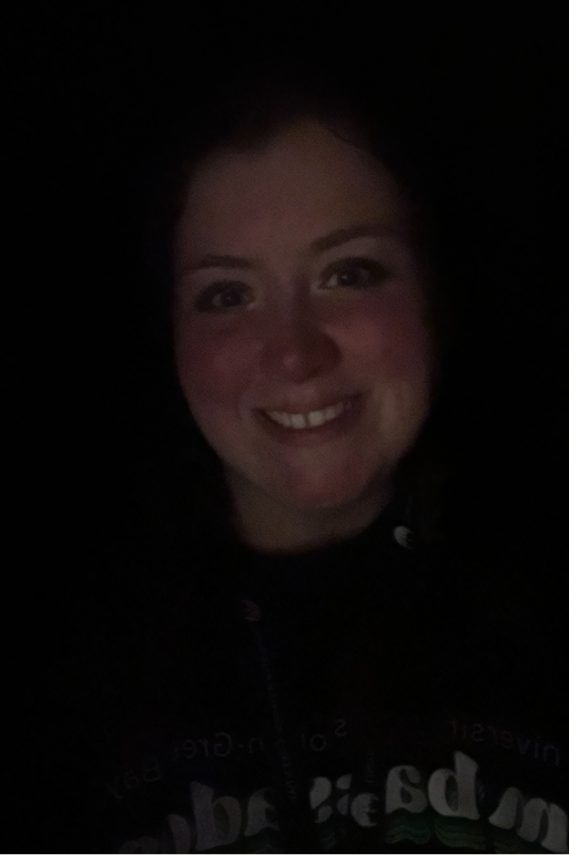 Female student in a dark room