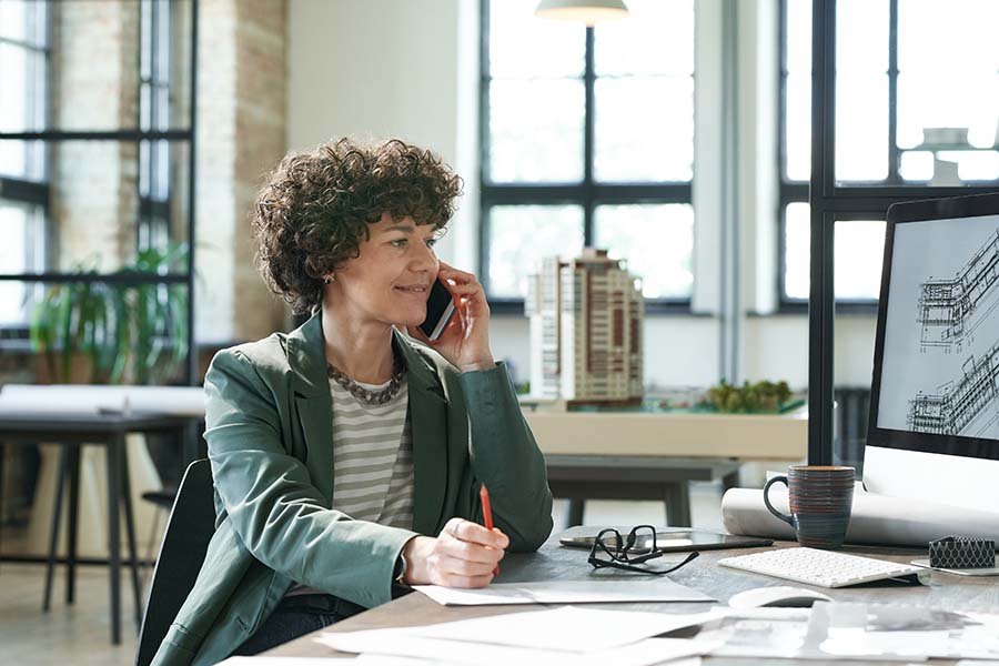 woman clerk talking with client on phone