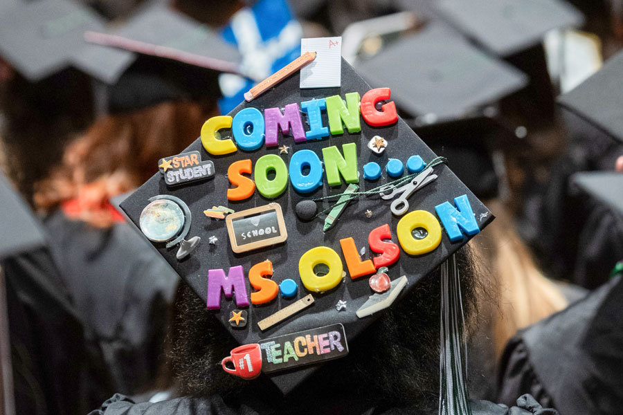 UW-Green Bay Student's graduation cap reading "coming soon...Ms. Olson"