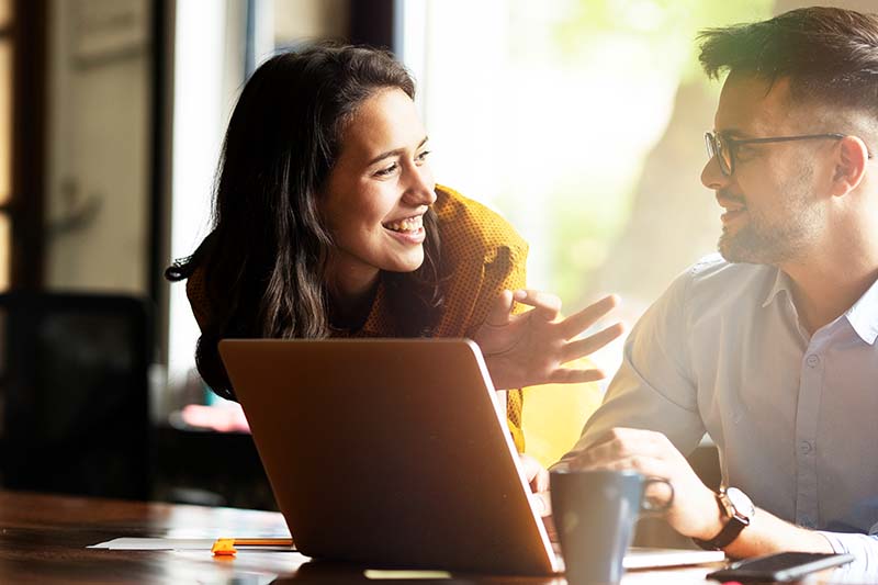woman supervisory providing feedback to employee