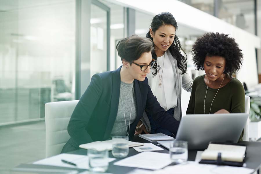 three women working together